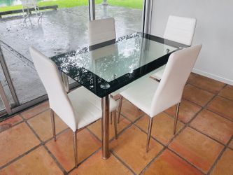 Glass table with 4 chairs