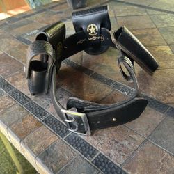 basketweave leather law enforcement duty belt + holster setup (LawPro / LawPro-style gear).