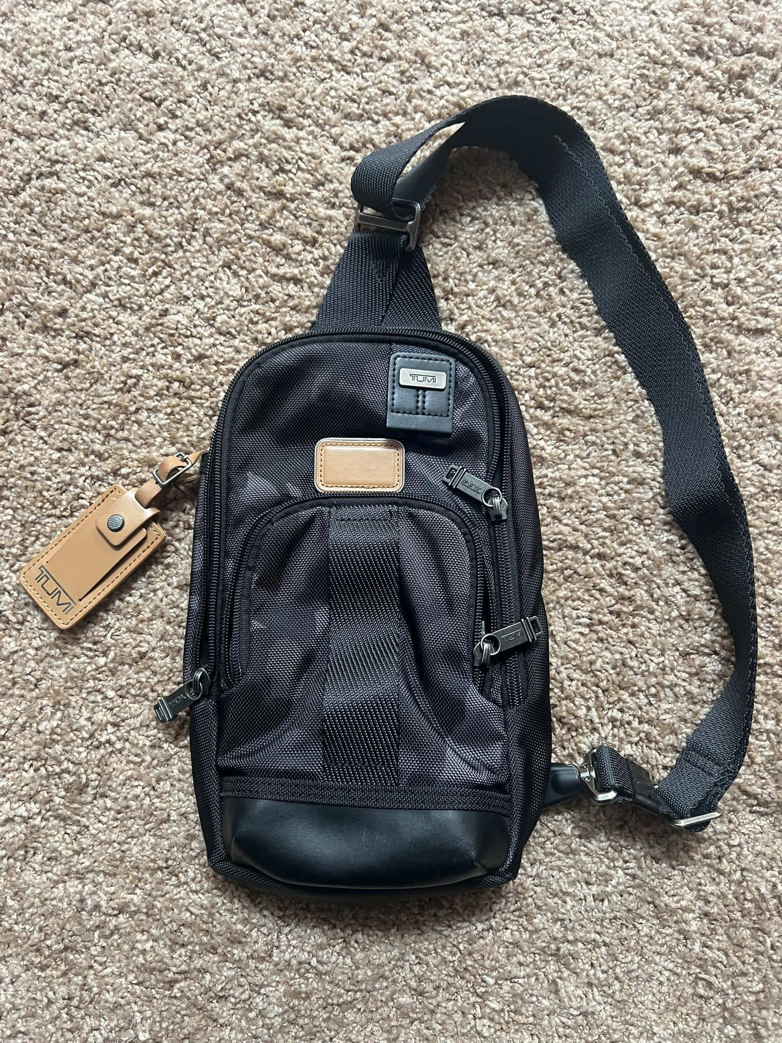 TUMI Crossbody Sling Bag – Black with Leather Accents