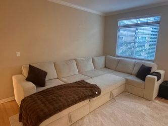 Living Spaces Cream Sectional w/ Bed Pullout