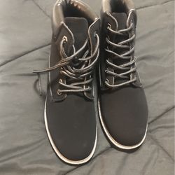 Women’s black high top boots