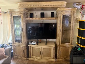 Light brown TV Entertainment center with wood carvings - 5 pieces