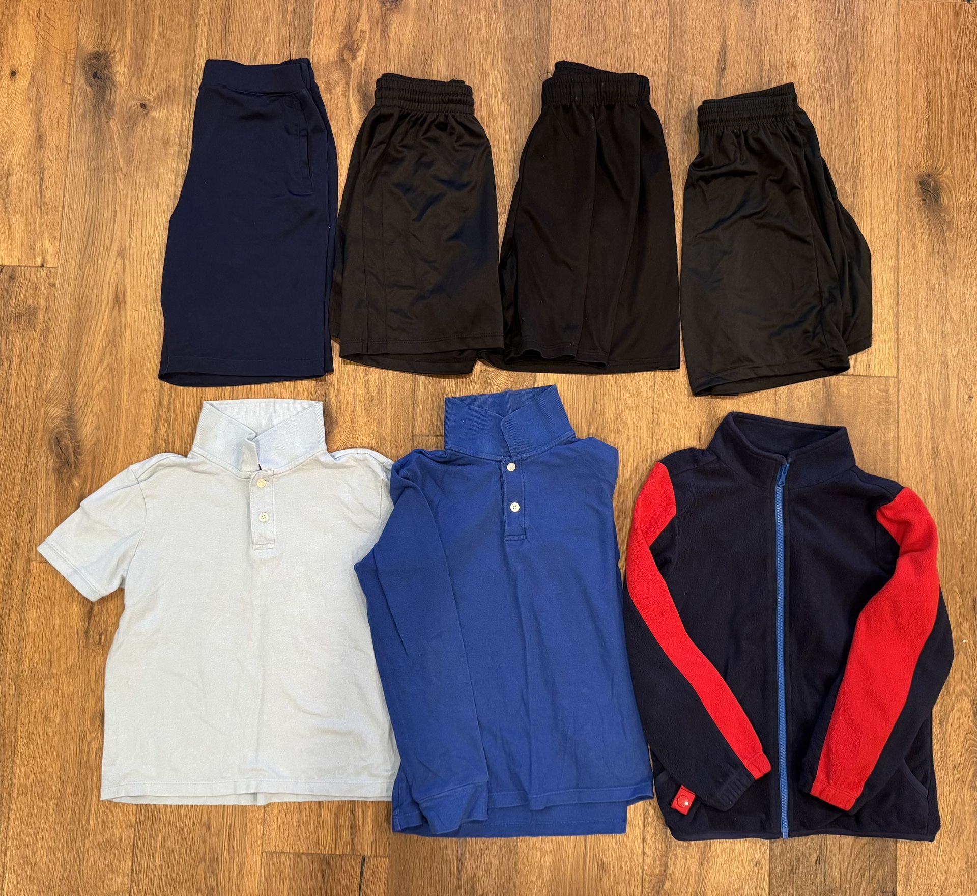 Polo shirts, sports shorts and fleece. Size 8 7 items for $8