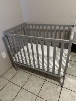 Delta Mini Crib with Mattress & Comforter – $45