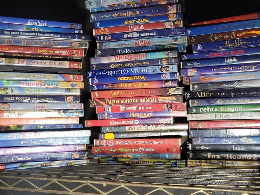 65 Walt DISNEY DVDS.