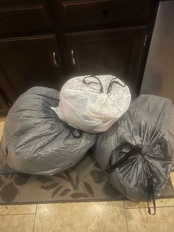Bags of assorted clothes