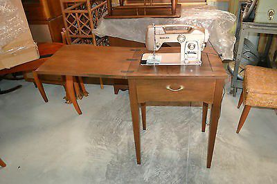 Modern home electric sewing machine antique in wooden cabinet