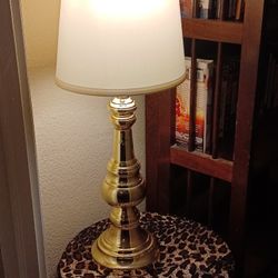 Brass lamp $,10, pashima, scarf, leopard design $10, Swivel seat stool used for table $,10.
