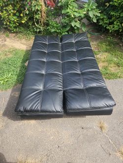 Adjustable leather futon In great shape