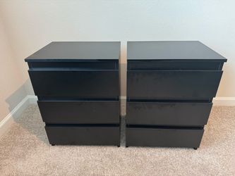 2 black bedside tables