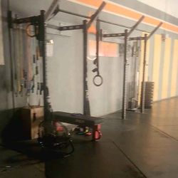 Wall mounted pull up/squat rack
