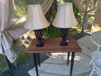 2 Lamps And A Table