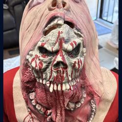 Skull coming out of human mask