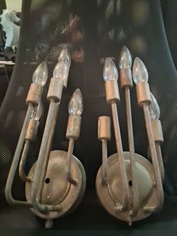 Pair of vintage 3βlight brass wall sconces in good working condition, perfect for adding instant character to your entryway, dining room, or hallway.