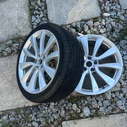 Two Tesla 19” Wheels. One with NEW tire. 
