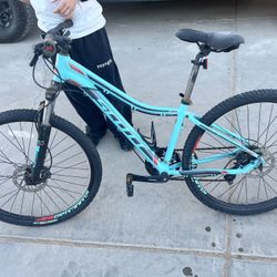 5 Mountain Bikes With Helmets All Specialized Except For One, Scott