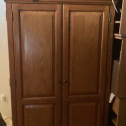 Solid wood, armoire, multiple shelves, pull out shelves, lots of compartments, beautiful piece