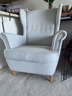 Beautiful Strandmon winged chair in light grey