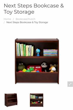 Toys R US solid wood Next Steps Bookcase & Toy Storage unit at bottom. Used in good condition with some  cosmetic blemishes. These blemishes are in th