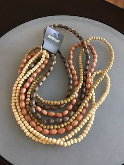 4 long strands of wooden beads from Avenue NEW