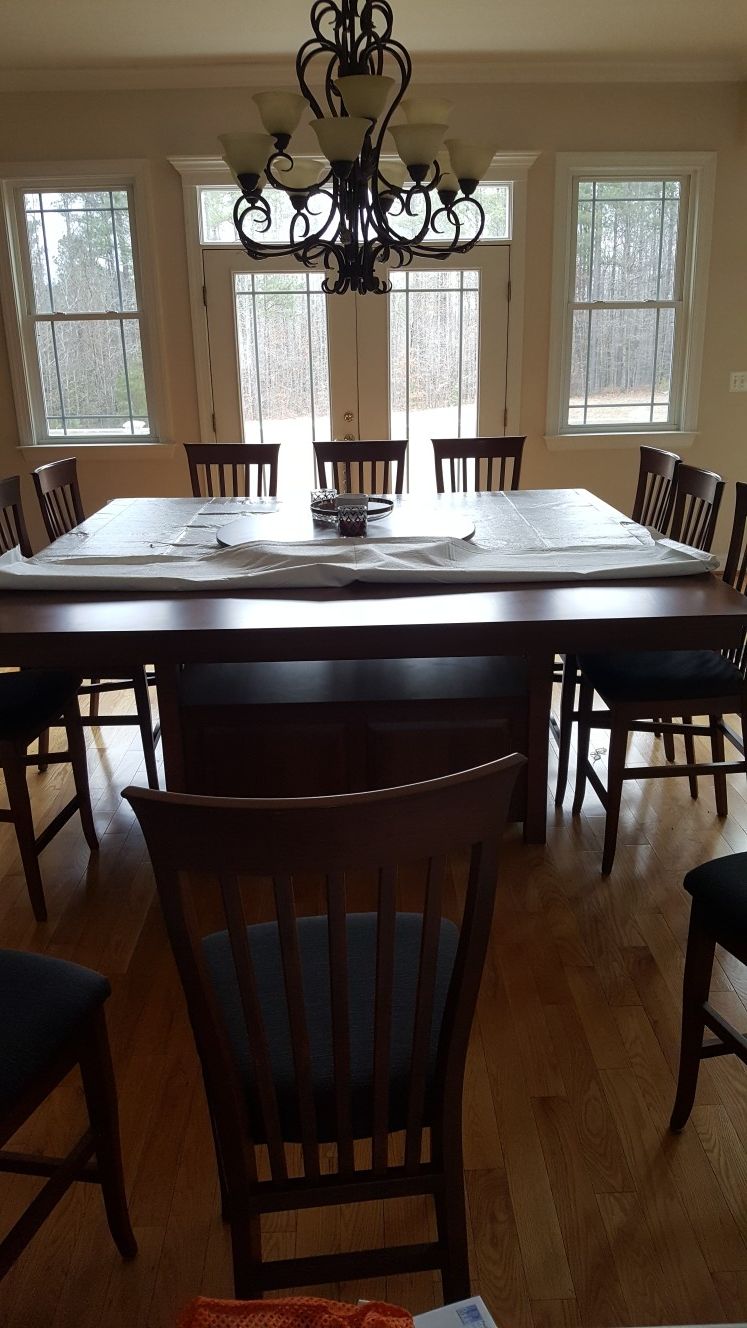 Kitchen dining table with chairs. Seats 12.
