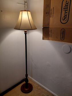 Brown wood corner floor lamp if listed its still available