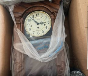 Hanging Wall Clock with Pendulum-Howard Miller