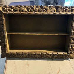 vintage wooden display shelf with carved frame 