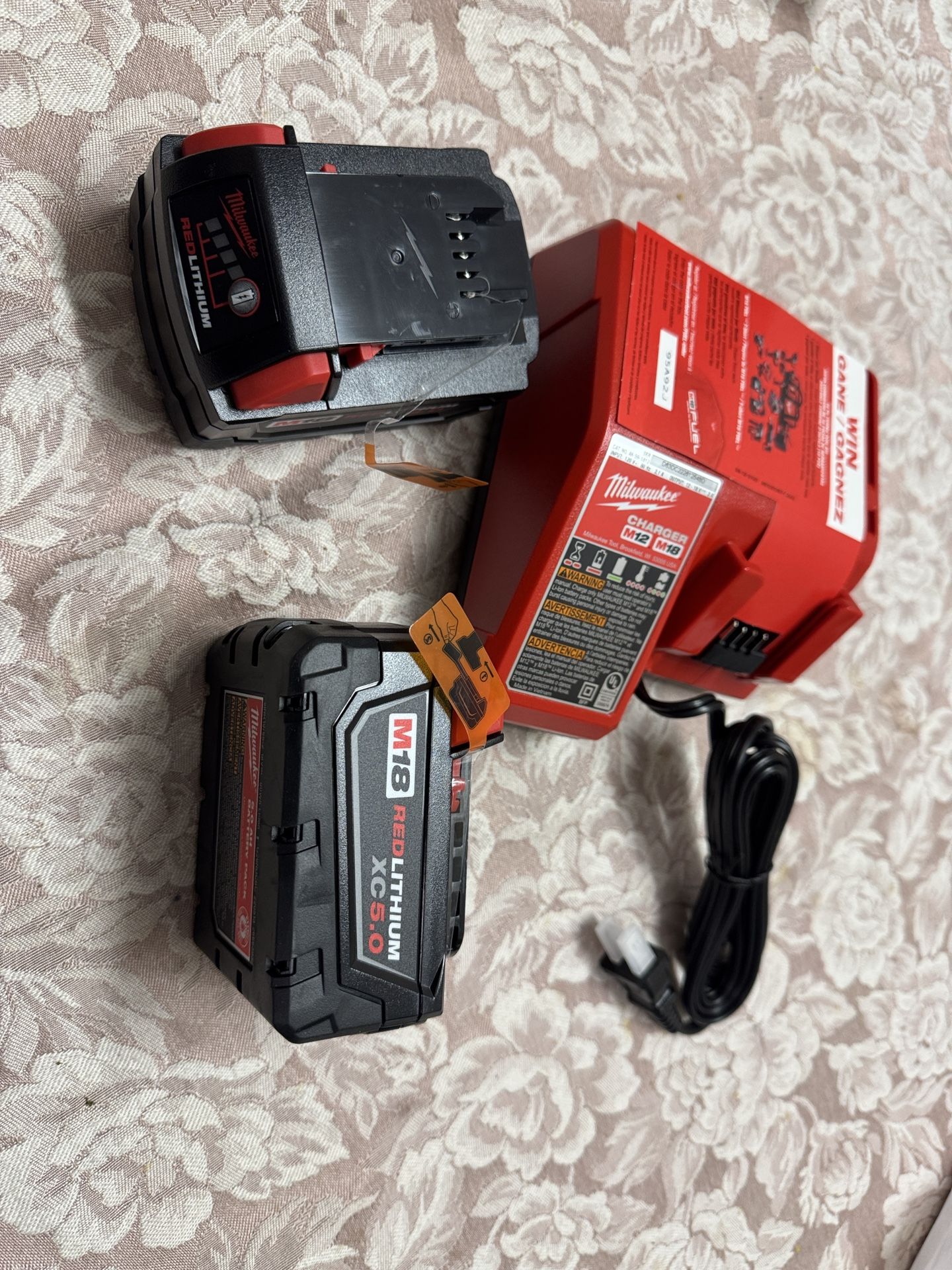 Milwaukee M18 18-Volt Lithium-Ion XC Extended Capacity 5.0 Ah Battery Pack (2-Pack)and Charger