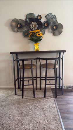 Set of bar table and 2 chairs included