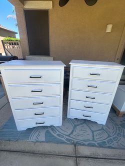 White dressers with black handles
