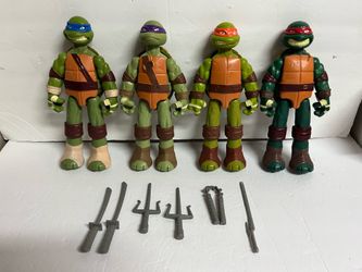 Lot of 4 Teenage Mutant Ninja Turtles w/weapons