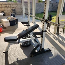 Bench, Olympic Bar And Rubber Weight Plates