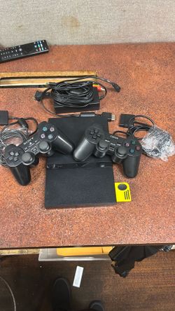 Sony slim PlayStation 2 w/ 2 controllers