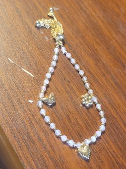 Beautiful feminine dainty jewelry.  Price reflects 925 gold plated starfish anklet, and freshwater pearl bracelet.