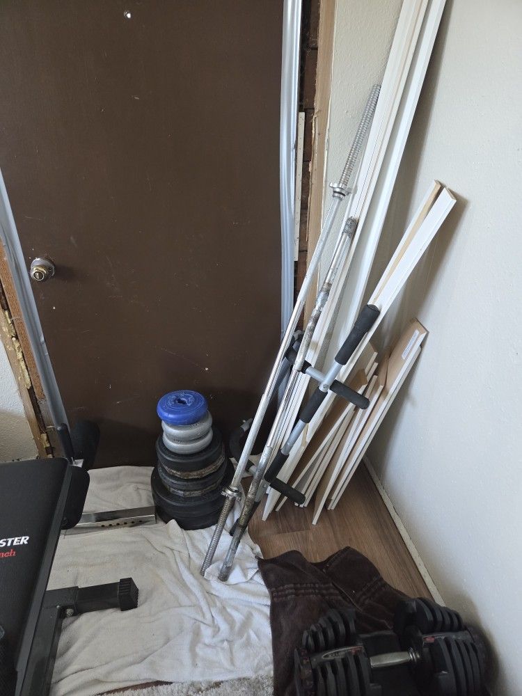 2 Bar Bells And Weights 20$