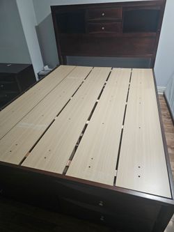 Dark Wood Queen Bed with built in shelves, drawers, and plush mattress