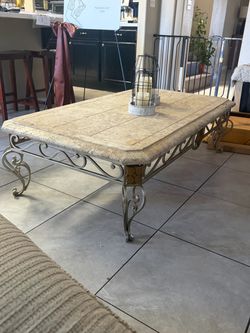 Stone top wrought iron coffee table