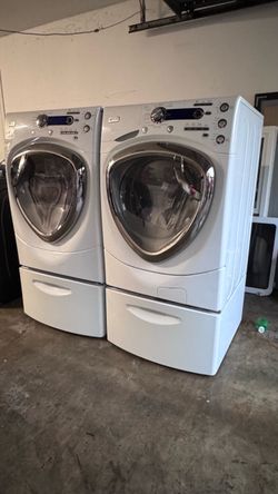 GE PROFILE WASHER AND DRYER SET with PEDESTALS.. $200