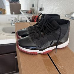 Air Jordan 11 “Bred” (Black/Red)
