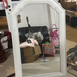 Pretty white distressed arch wall mirror