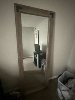 large wood bordered mirror