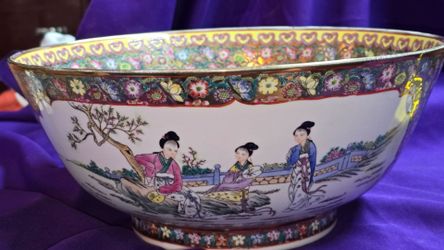 Large Chinese Porcelain Bowl featuring a figural scene of ladies in a garden and a millefleurs floral border. 14 inch diameter