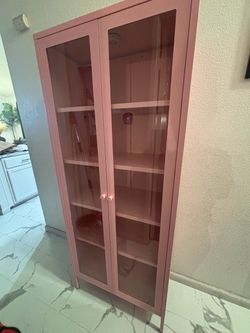Pink cabinet with glass doors