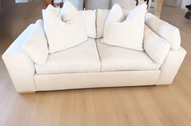 One white natural fabric loveseat cloud couch Living Spaces Nate Berkus Jeremiah