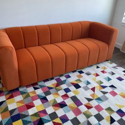 Gently Used Orange Sofa