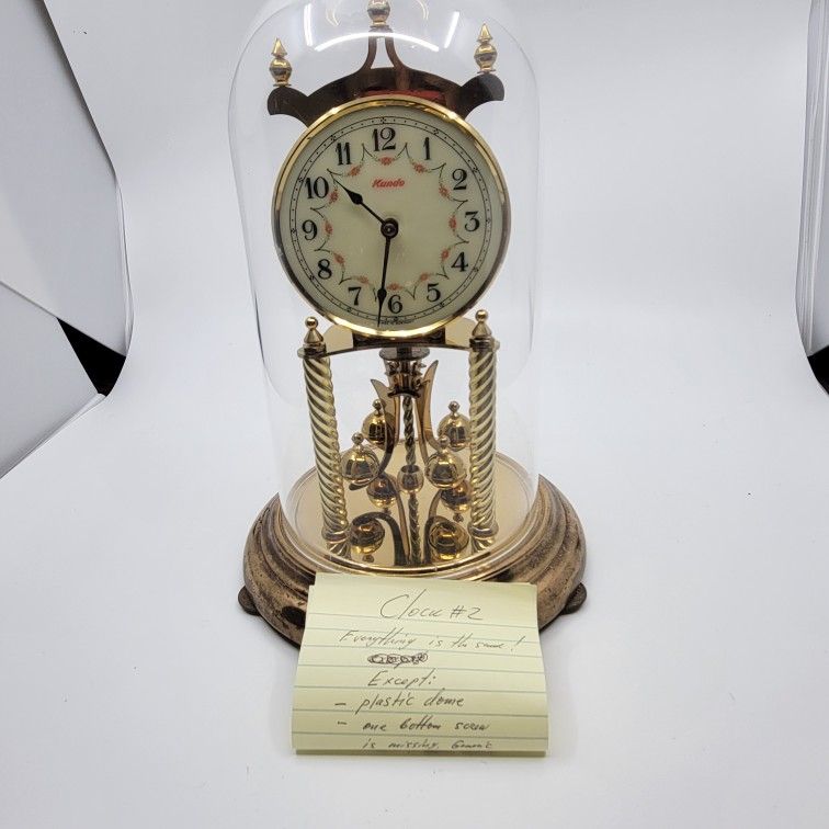 Vintage German Kundo Floral 400 Day Kieninger & Obergfell Torsion 
Anniversary mantel clock. Made in West Germany. Plastic dome.
Clock prior to listin