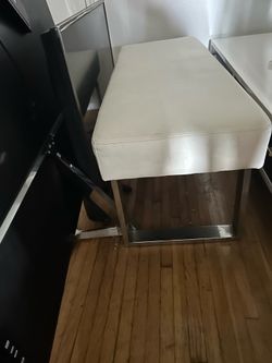 White cushiony benc.  Leather no damage