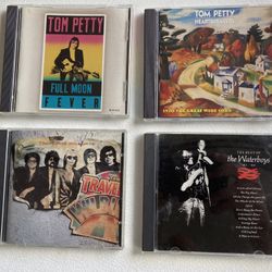 Set Of All 4 Tom Petty And Traveling Wilburys And The Waterboys CDs. 