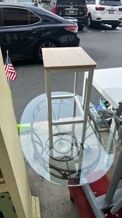 backless industrial-style bar stool with a natural wood-look seat and a white metal frame